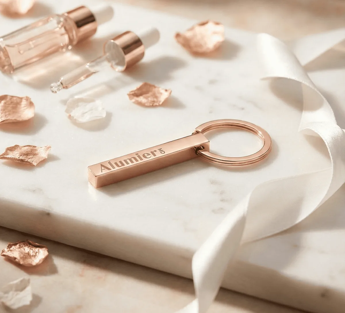 Custom engraved metal keyring in rose gold finish